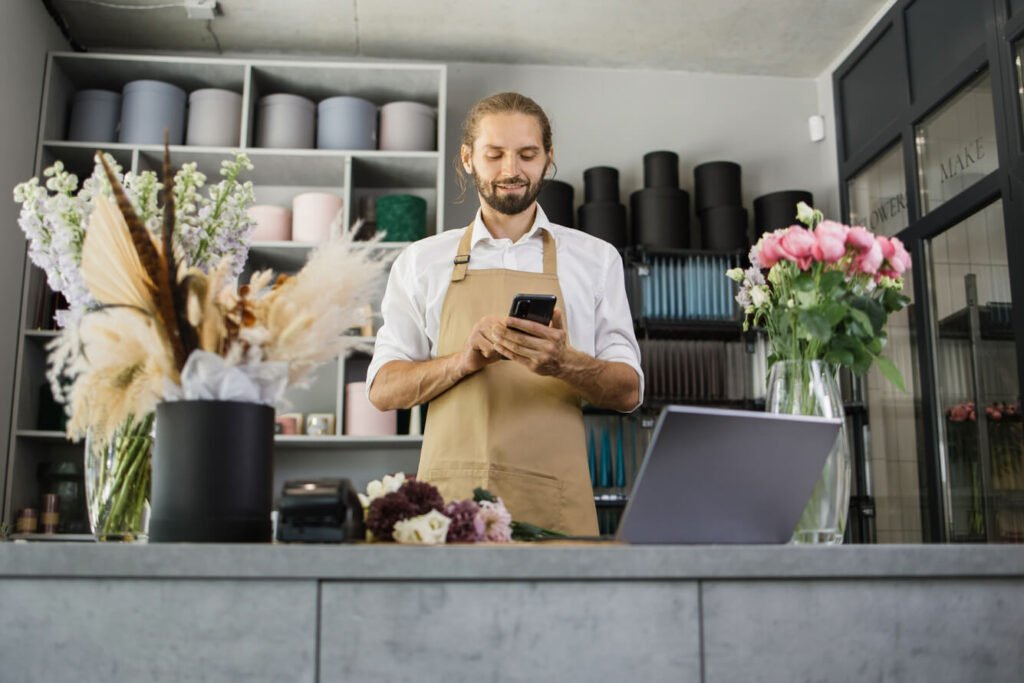 young-bearded-male-florist-in-flower-shop-writing-2022-08-01-18-41-32-utc.jpg